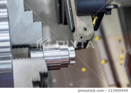 The CNC lathe machine forming cutting the metal shaft parts. The CNC lathe machine forming cutting the metal shaft parts. 113400449