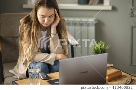 Project's Weight : Amid the silent hum of productivity, an office worker feels the acute sting of a stress-induced headache Project's Weight : Amid the silent hum of productivity, an office worker feels the acute sting of a stress-induced headache 113400822
