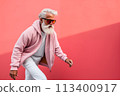 stylish elderly man in sunglasses walks outdoors on pink background 113400917