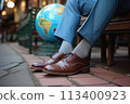 Businessman's feet with a globe in the park, the concept of business connections around the world 113400923