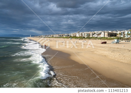 A coastline lined with resort hotels and resort condominiums A coastline lined with resort hotels and resort condominiums 113401213