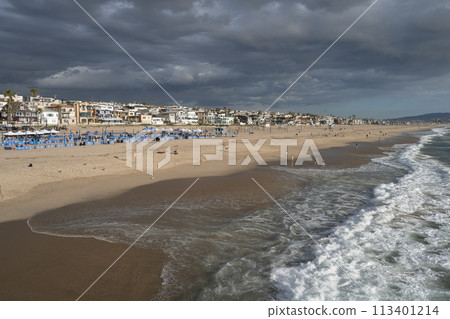 A coastline lined with resort hotels and resort condominiums A coastline lined with resort hotels and resort condominiums 113401214