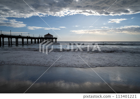 Santa Monica beach on the West Coast with blue skies peeking through Santa Monica beach on the West Coast with blue skies peeking through 113401221