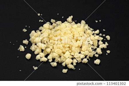 Grated parmesan cheese on black background, full depth of field Grated parmesan cheese on black background, full depth of field 113401302