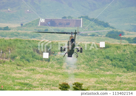 The Japan Ground Self-Defense Force's AH-1S anti-tank helicopter fires its machine gun The Japan Ground Self-Defense Force's AH-1S anti-tank helicopter fires its machine gun 113402154