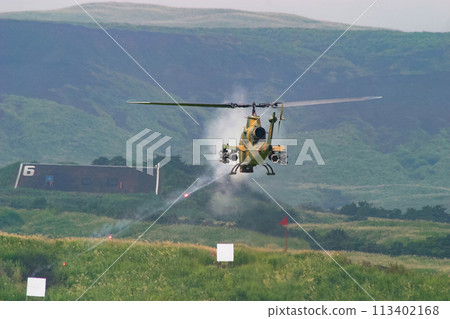 The Japan Ground Self-Defense Force's AH-1S anti-tank helicopter fires its machine gun The Japan Ground Self-Defense Force's AH-1S anti-tank helicopter fires its machine gun 113402168
