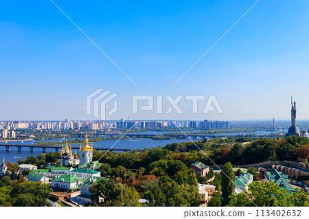 View of Kiev Pechersk Lavra (Kiev Monastery of the Caves),  Motherland Monument and the Dnieper river in Ukraine. View from Great Lavra Bell Tower 113402632