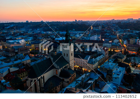 Aerial view of Latin cathedral and Rynok square in Lviv, Ukraine at sunset. View from Lviv town hall Aerial view of Latin cathedral and Rynok square in Lviv, Ukraine at sunset. View from Lviv town hall 113402652