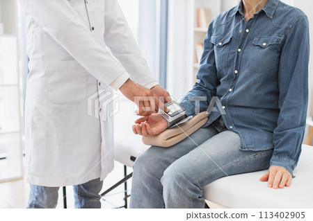 Crop of doctor and patient having talk about diagnosis and medical checkup. 113402905