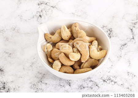 Cashew nuts heap in the bowl 113403208