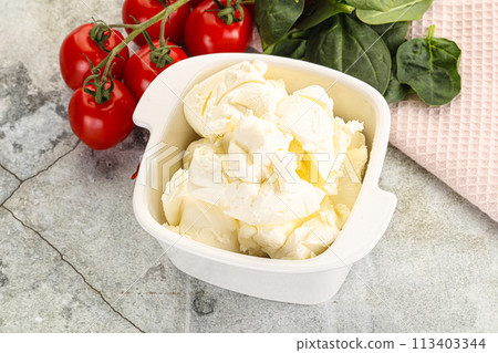 Soft cream cheese in the bowl 113403344