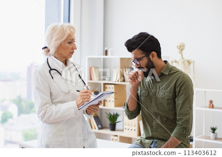 Elder specialist writing instruction for taking medication correctly. Elder specialist writing instruction for taking medication correctly. 113403612