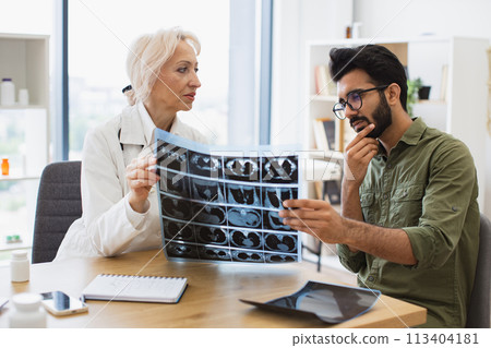 Anxious man carefully listening to physician's instructions. 113404181