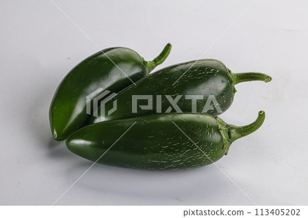 Raw green Mexican jalapeno pepper Raw green Mexican jalapeno pepper 113405202