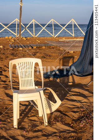 Chair on the beach in the sunlight, Sicily Chair on the beach in the sunlight, Sicily 113405441