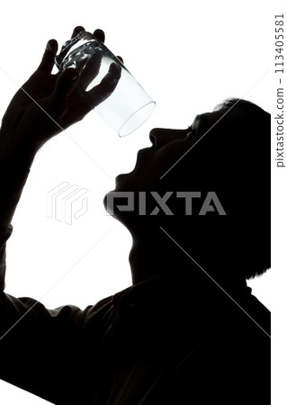 Young man drinks soda water, no water - silhouette Young man drinks soda water, no water - silhouette 113405581