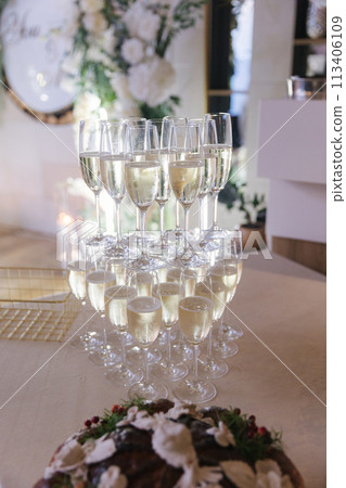Little pyramid of champagne glasses on wedding 113406109