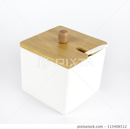 Close-up of a ceramic box for storing salt or sugar. Close-up of a ceramic box for storing salt or sugar. 113406512