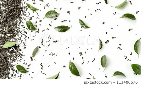 Black tea leaves scattered on a white background with fresh green tea leaves 113406670