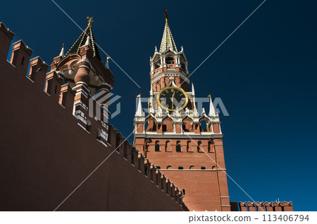 Spasskaya Tower of the Moscow Kremlin. Moscow chimes against the background of a blue sky . High quality photo 113406794
