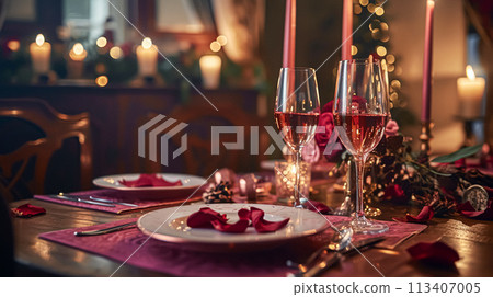 Festive table setting  with cutlery, candles and beautiful red flowers in vase 113407005