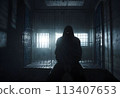 A hooded man in a dark prison cell. AI created.  113407653