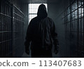 A hooded man in a dark prison cell. AI created.  113407683