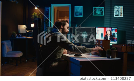 Man inserting classified disk into PC containing sentient AI waving hand, greeting creator. Scientist placing confidential cartridge in computer, awakening self aware artificial intelligence, camera B 113408227