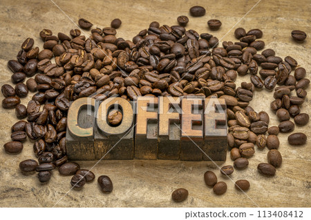 sampler of coffee beans from different parts of the world with coffee word in vintage letterpress wood type 113408412
