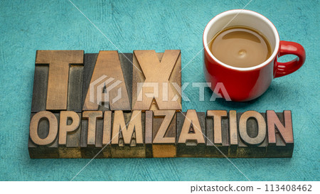 tax optimization, financial concept in vintage letterpress wood type with coffee, business and tax planning tax optimization, financial concept in vintage letterpress wood type with coffee, business and tax planning 113408462
