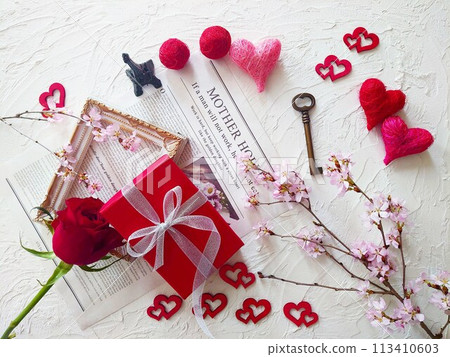 Red box gift with heart and cherry blossom Red box gift with heart and cherry blossom 113410603
