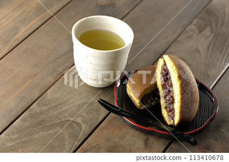 Cut dorayaki and green tea Cut dorayaki and green tea 113410678