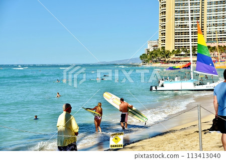 Beach and surfers 113413040