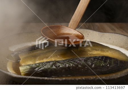 Braised eggplant, served 113413697