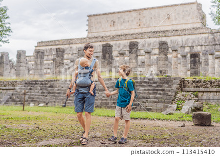 Father and two sons tourists observing the old pyramid and temple of the castle of the Mayan architecture known as Chichen Itza these are the ruins of this ancient pre-columbian civilization and part Father and two sons tourists observing the old pyramid and temple of the castle of the Mayan architecture known as Chichen Itza these are the ruins of this ancient pre-columbian civilization and part 113415410