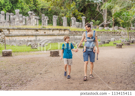 Father and two sons tourists observing the old pyramid and temple of the castle of the Mayan architecture known as Chichen Itza these are the ruins of this ancient pre-columbian civilization and part 113415411