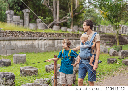 Father and two sons tourists observing the old pyramid and temple of the castle of the Mayan architecture known as Chichen Itza these are the ruins of this ancient pre-columbian civilization and part 113415412