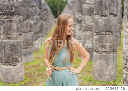 Beautiful tourist woman observing the old pyramid and temple of the castle of the Mayan architecture known as Chichen Itza these are the ruins of this ancient pre-columbian civilization and part of Beautiful tourist woman observing the old pyramid and temple of the castle of the Mayan architecture known as Chichen Itza these are the ruins of this ancient pre-columbian civilization and part of 113415430