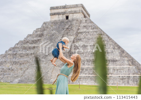 Beautiful tourist woman and her son baby observing the old pyramid and temple of the castle of the Mayan architecture known as Chichen Itza these are the ruins of this ancient pre-columbian Beautiful tourist woman and her son baby observing the old pyramid and temple of the castle of the Mayan architecture known as Chichen Itza these are the ruins of this ancient pre-columbian 113415443