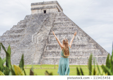 Beautiful tourist woman observing the old pyramid and temple of the castle of the Mayan architecture known as Chichen Itza these are the ruins of this ancient pre-columbian civilization and part of Beautiful tourist woman observing the old pyramid and temple of the castle of the Mayan architecture known as Chichen Itza these are the ruins of this ancient pre-columbian civilization and part of 113415458
