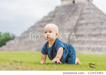 Baby traveler, tourists observing the old pyramid and temple of the castle of the Mayan architecture known as Chichen Itza these are the ruins of this ancient pre-columbian civilization and part of 113415463