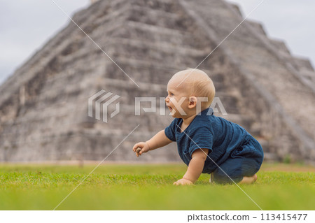 Baby traveler, tourists observing the old pyramid and temple of the castle of the Mayan architecture known as Chichen Itza these are the ruins of this ancient pre-columbian civilization and part of 113415477