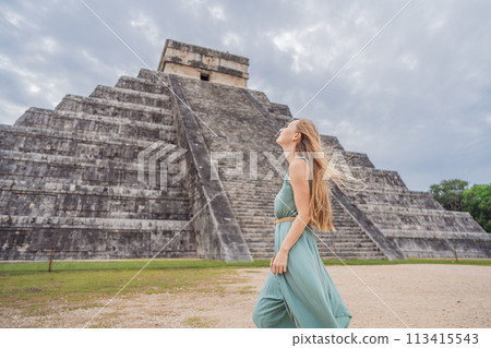 Beautiful tourist woman observing the old pyramid and temple of the castle of the Mayan architecture known as Chichen Itza these are the ruins of this ancient pre-columbian civilization and part of Beautiful tourist woman observing the old pyramid and temple of the castle of the Mayan architecture known as Chichen Itza these are the ruins of this ancient pre-columbian civilization and part of 113415543
