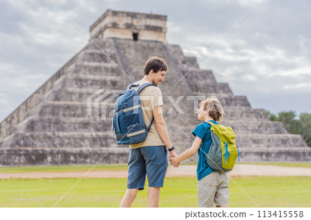 Father and son tourists observing the old pyramid and temple of the castle of the Mayan architecture known as Chichen Itza these are the ruins of this ancient pre-columbian civilization and part of 113415558