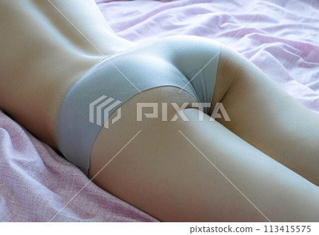 Naked body of beautiful sexy woman and female ass in white panties in bed concept of a female model in a fashion house.matrue concept Naked body of beautiful sexy woman and female ass in white panties in bed concept of a female model in a fashion house.matrue concept 113415575