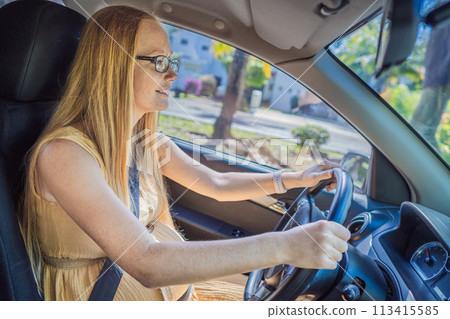 Pregnant woman driving with safety belt on in the car. Confident and capable, a pregnant woman takes the wheel, driving with care and determination as she navigates the journey of motherhood Pregnant woman driving with safety belt on in the car. Confident and capable, a pregnant woman takes the wheel, driving with care and determination as she navigates the journey of motherhood 113415585