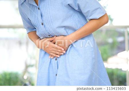 People have abdominal pain. Take a hand from the belly diarrhea.Health concept 113415603
