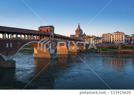 Landscape of covered bridge and Pavia cathedral at sunset 113415626