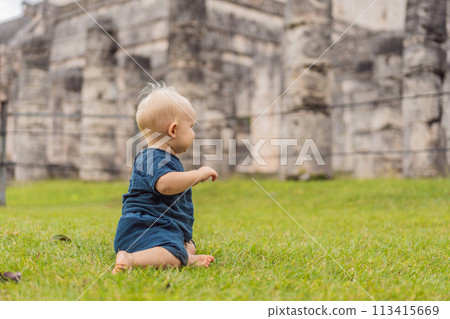 Baby traveler, tourists observing the old pyramid and temple of the castle of the Mayan architecture known as Chichen Itza these are the ruins of this ancient pre-columbian civilization and part of 113415669