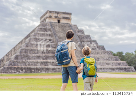 Father and son tourists observing the old pyramid and temple of the castle of the Mayan architecture known as Chichen Itza these are the ruins of this ancient pre-columbian civilization and part of 113415724